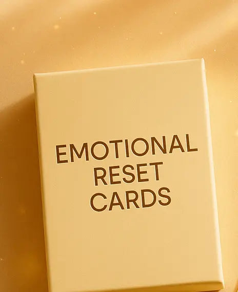 Box of 'Emotional Reset Cards' on a gold background